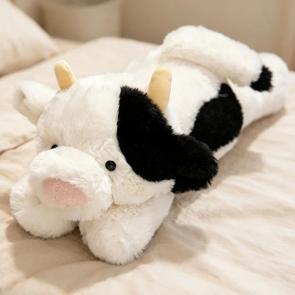 Peluche vache tachetée allongée